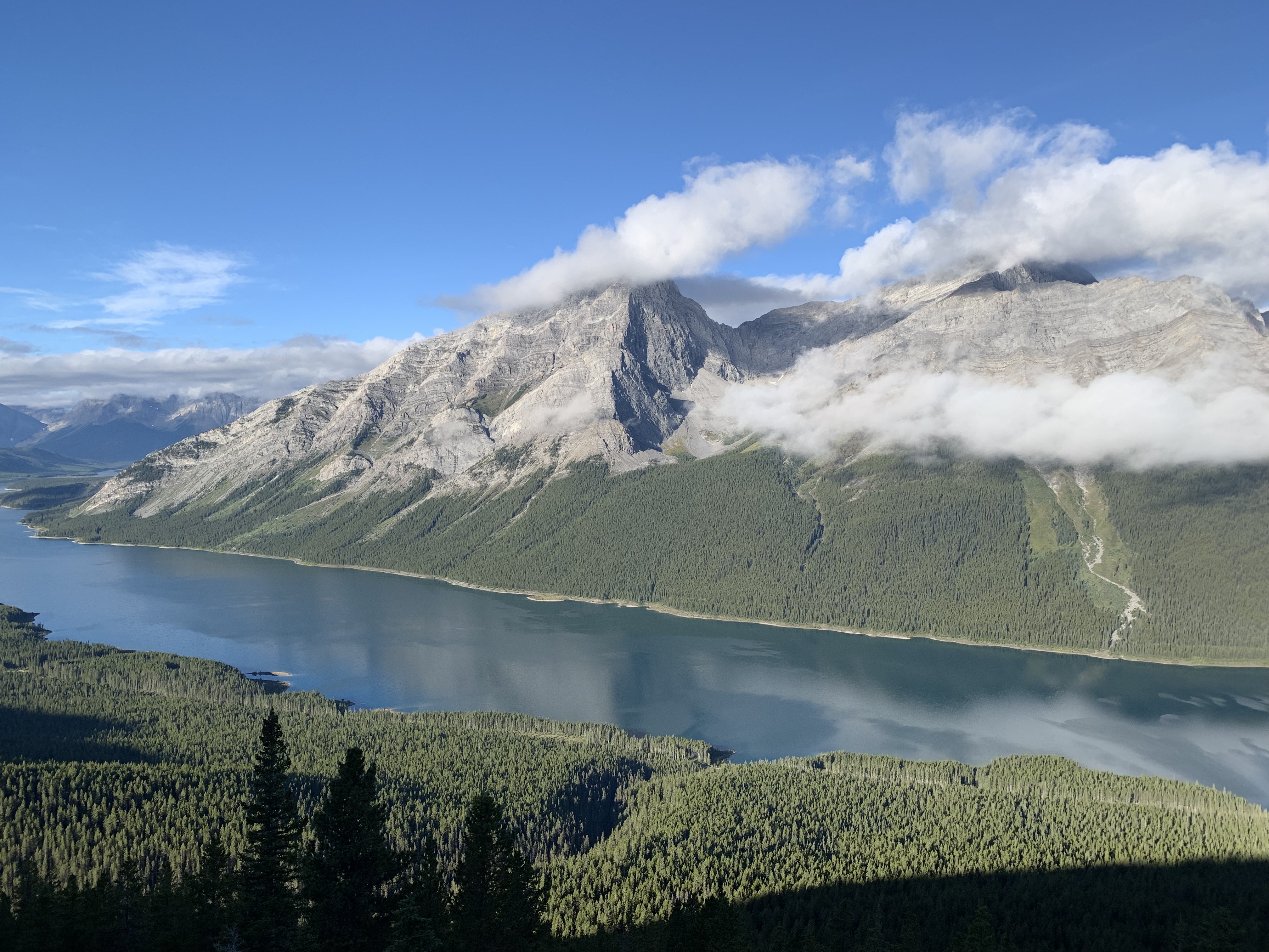 A first view of the Spray Reservoir and cloudy Mount Nestor and Old Goat Mountain from the Read's Tower/Mount Sparrowhawk route