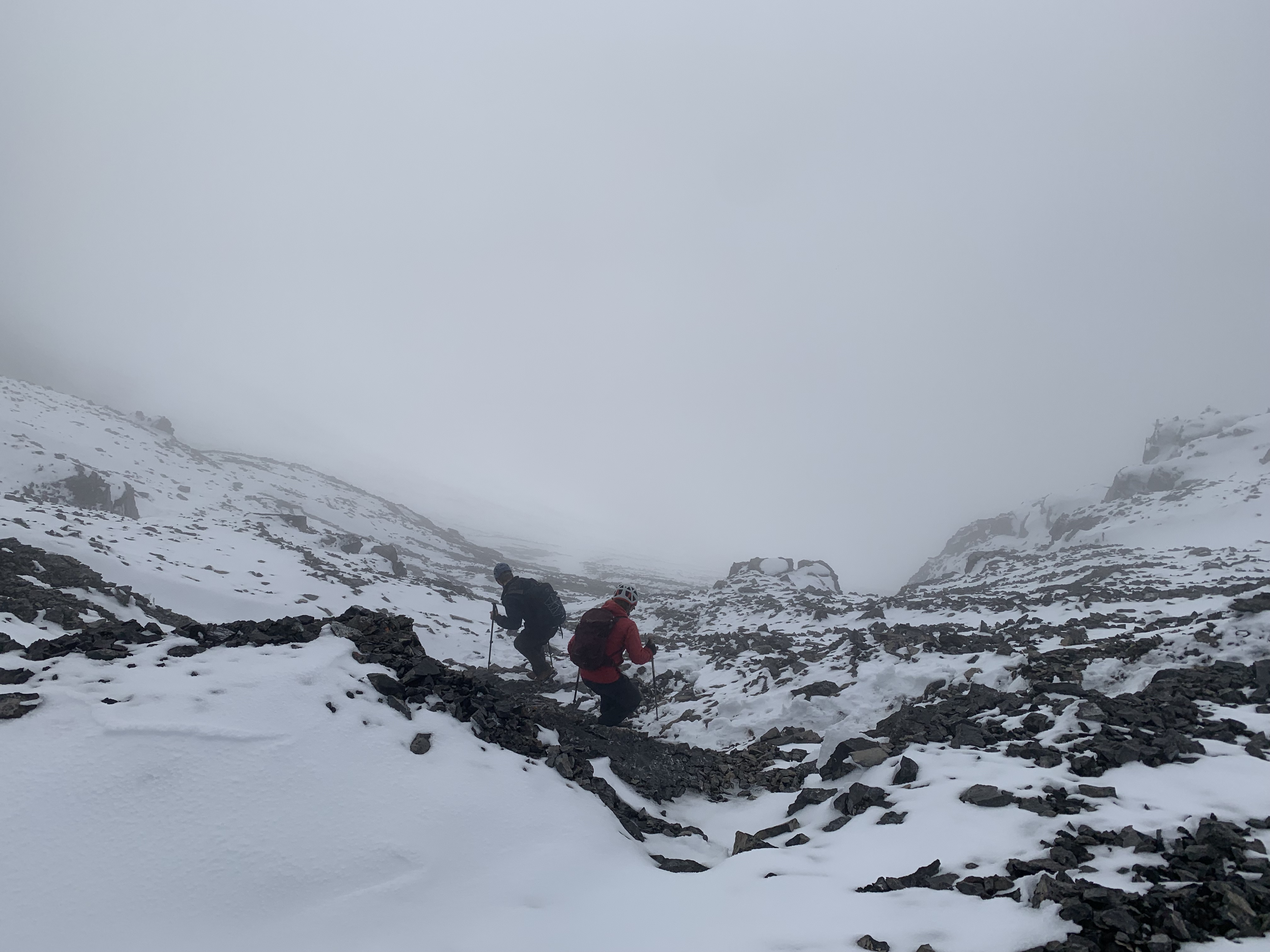 Our friends descending into the fog from Mount Sparrowhawk