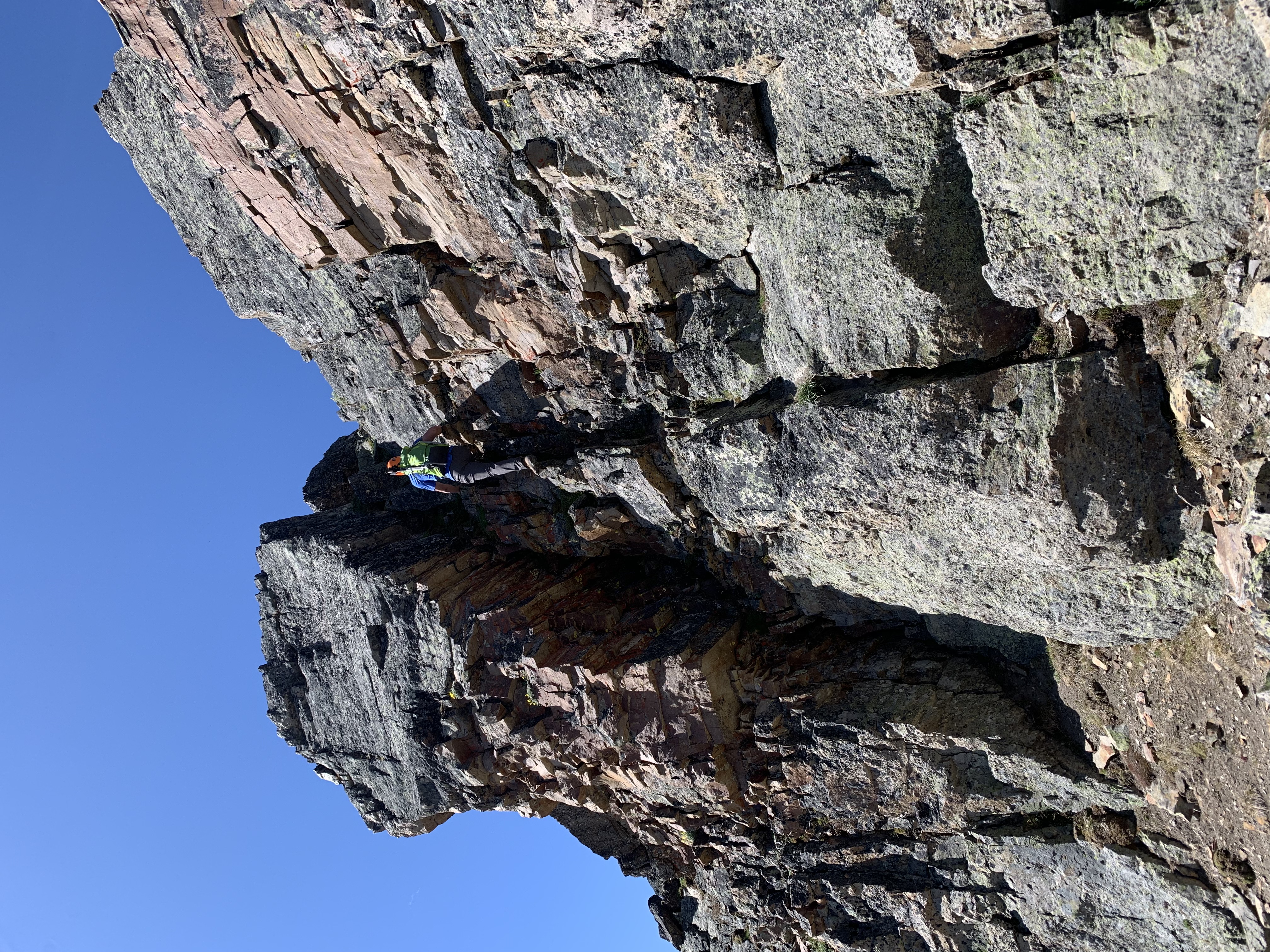 Ezra scrambling up an optional step on the traverse between Mount Collembola and Mount Allan