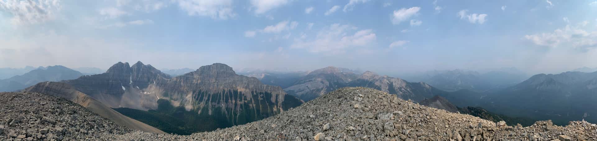 Summit pano from Brewster Peak. There was sadly a lot of smoke on this day, but we could just make out Mount Ball at center, between Eagle Mountain (left of center) and Mount Bourgeau (right of center).