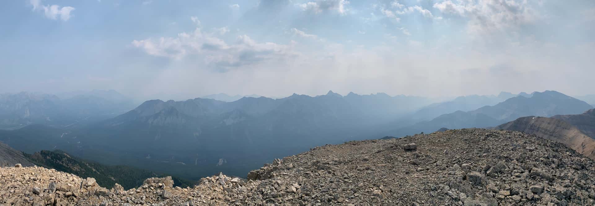 Looking over the Brewster Creek valley to the Sundance Range, which is partially obscured by the smoke. Apparently it actually has several unclimbed peaks. Maybe we can claim a true first ascent over there.