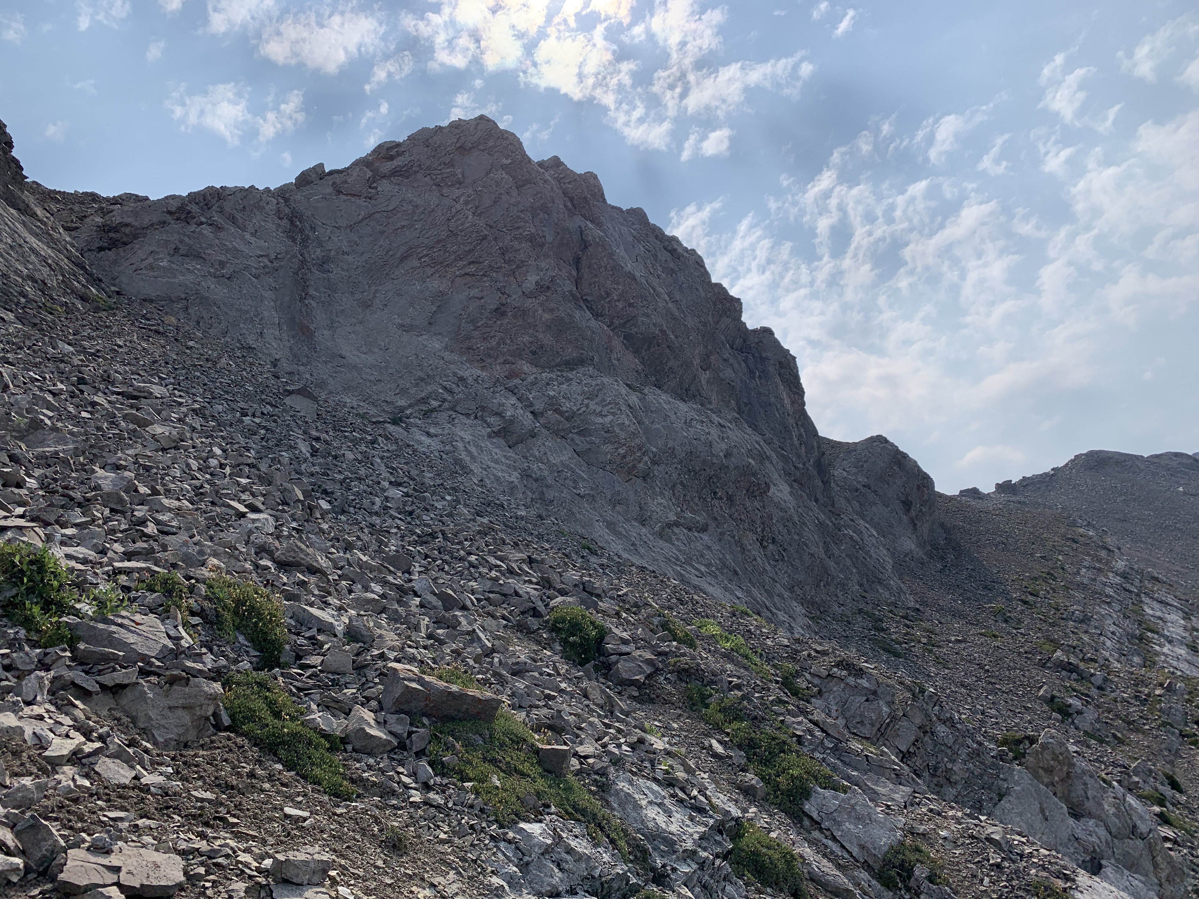 The gully is at left. Another possible scree traverse bypass lies right to get to the summit of Brewster Peak